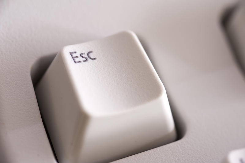 close up on the escape key on a computer keyboard