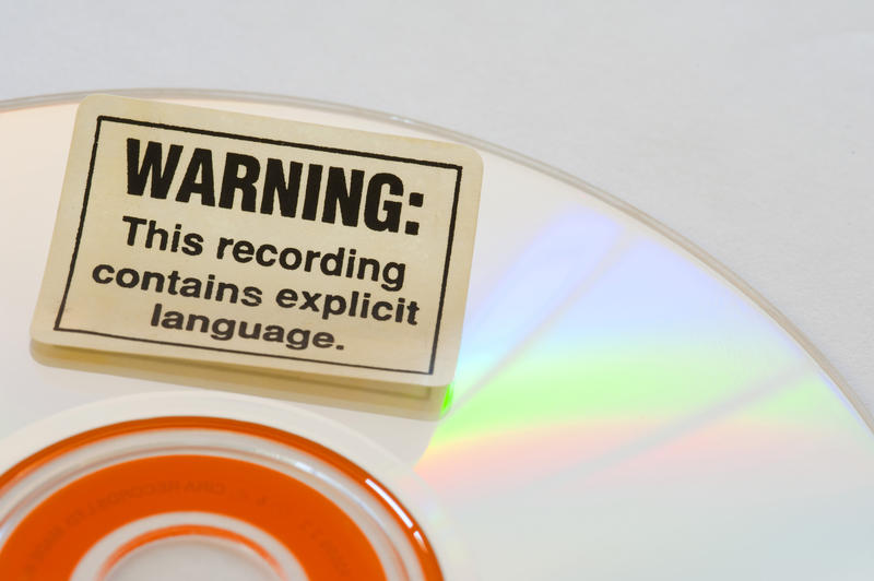 a explicit lyrics warning sticker on a CD