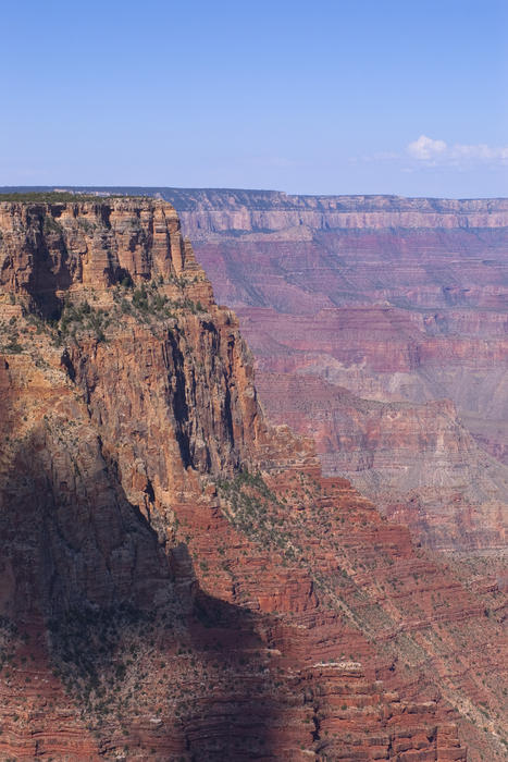 and image of the rim of the grand canyon showing off its many orange and red colured rock layes