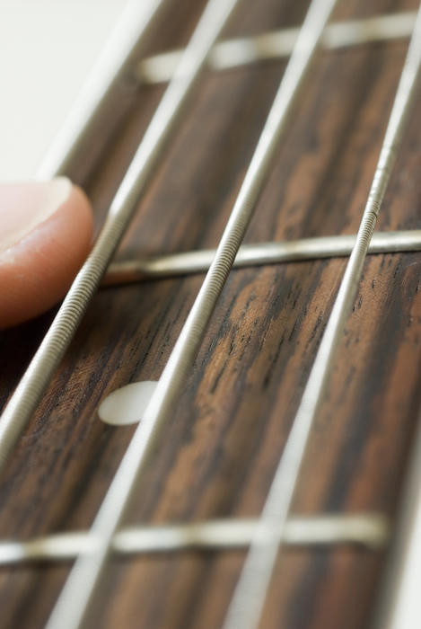 close up image of guitar strings taken with a narrow depth of field