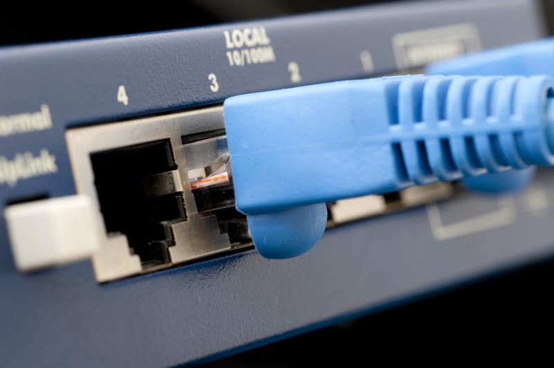 an Ethernet cable pluged into a network router