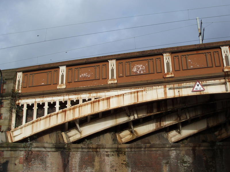 grunge details of a railway bridge in central manchester, uk