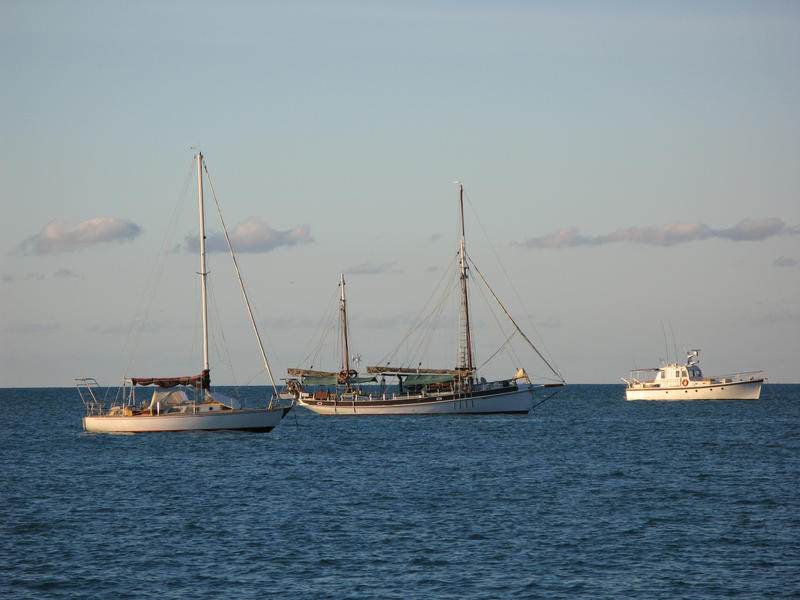 a ketch rigged sail boat on the water