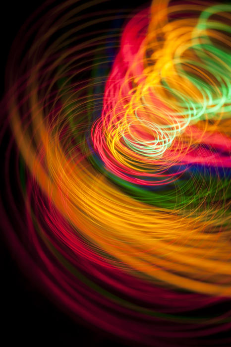 a dramatic background image of brightly coloured light