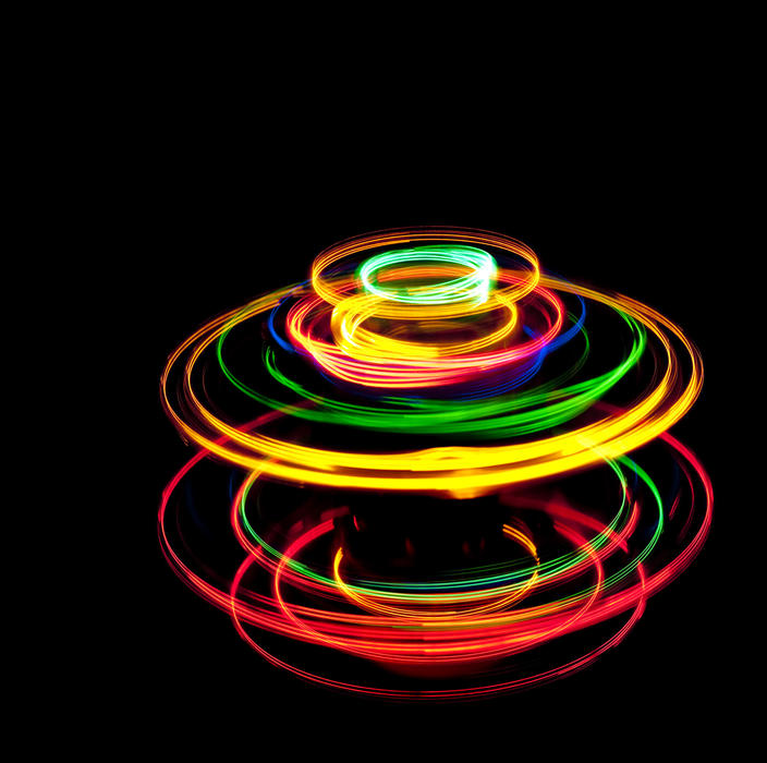 trails created by spinning lights creating an outline line like that of a childs toy spinning top