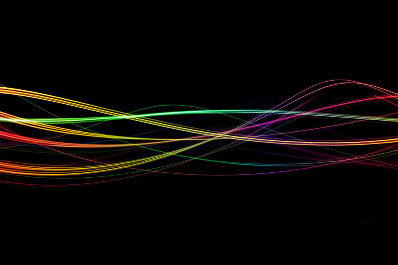 colourful wave effect created from traces of multicoloured lights