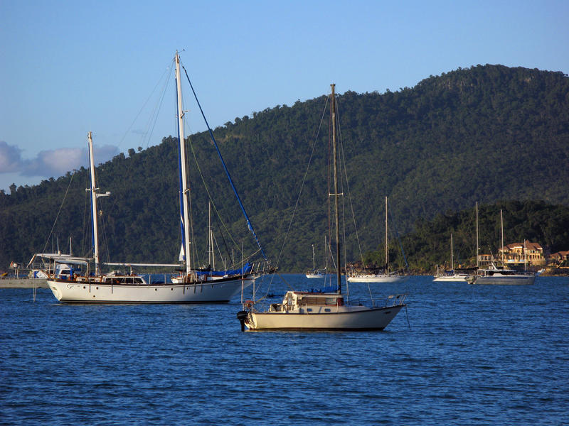 boats moored of the coast of airle beach near mandalay point