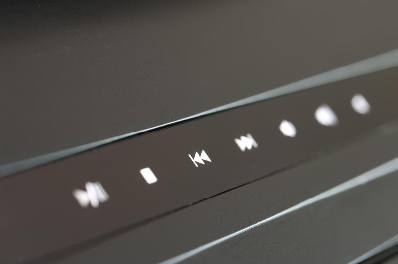 a row of multimedia playback controls pictured with a narrow depth of field