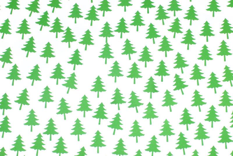 a background of green christmas pine tree shapes with a space for one missing tree