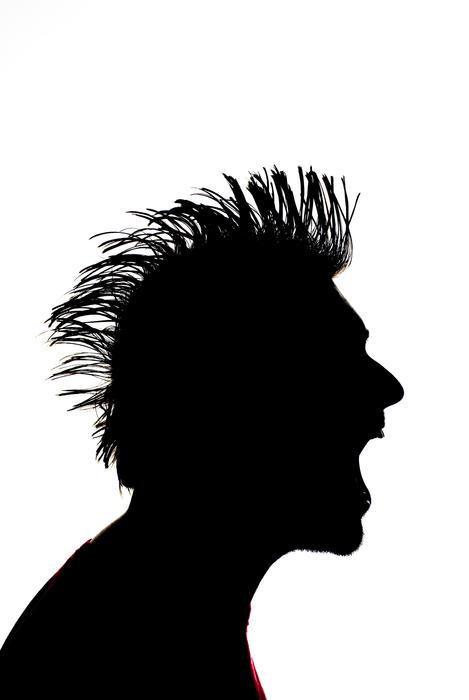sillhouette of a man with a mohawk hairstyle