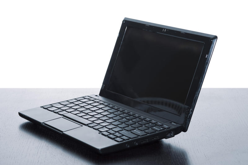 an open laptop computer pictured with a blue tint