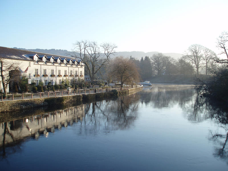 a view of the newby bridge hotel at the end of lake windermere on a cold winter morning