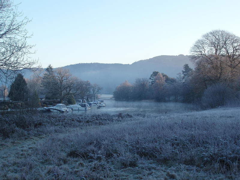 a view of lake windermere at newby bridge on a cold winter morning