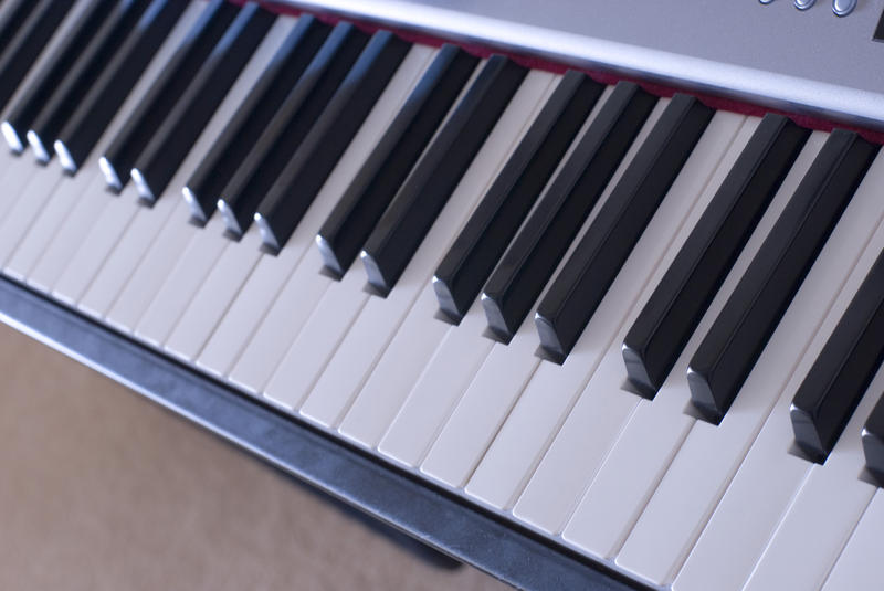 keys on a piano keyboard pictured at 45 degrees