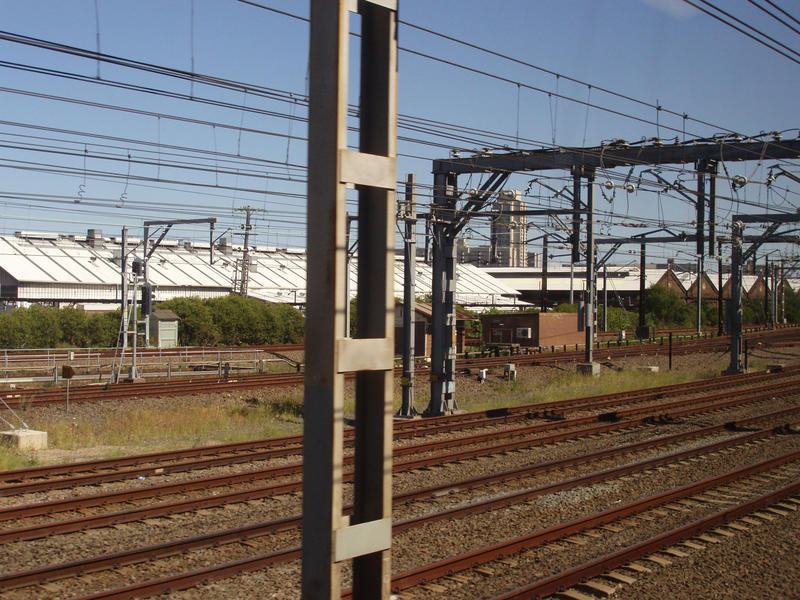 a series of rail lines through an urban industrial area