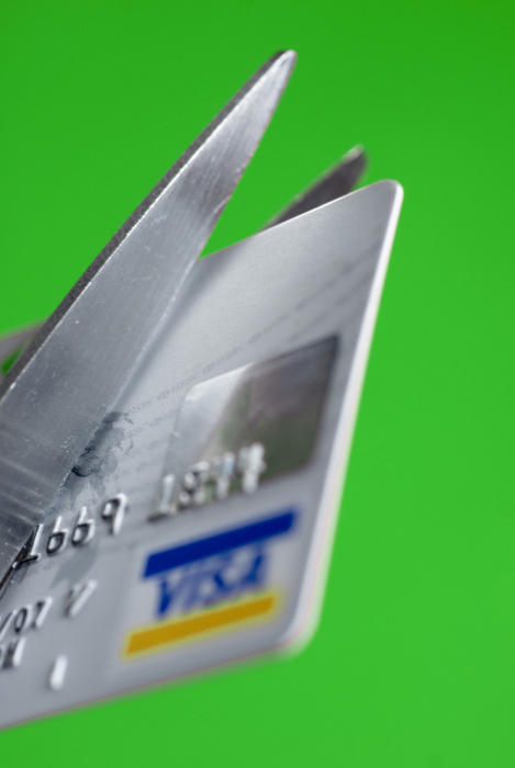 cutting up a credit card to reduce spending