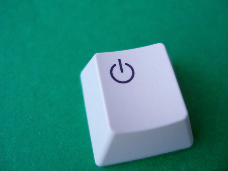 a standby hibernate button removed from a computer keyboard, concept of energy savings