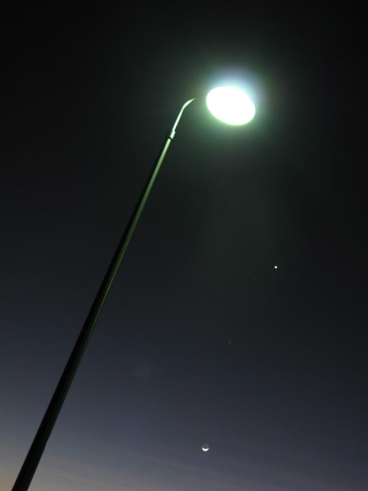 a lamp post lit at night