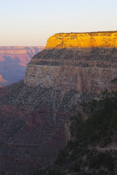 last light of the day illuminates the escarpments on the south rim of the grand canyon
