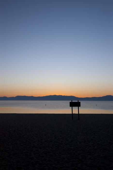 cool blue and orange sunset over the shore of lake tahoe