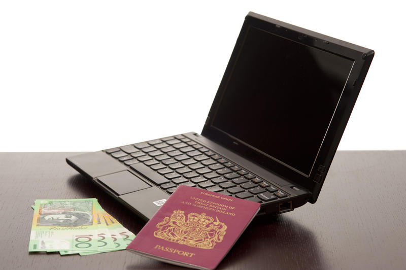 modern travel, a netbook computer, passport and money