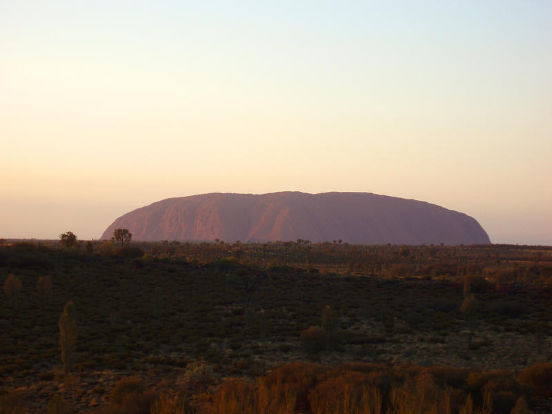 uluru (ayres rock) catching the first light of day
