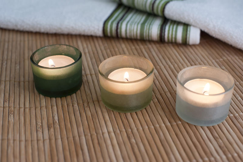 aromatherapy tealights and towels for a relaxing bath time