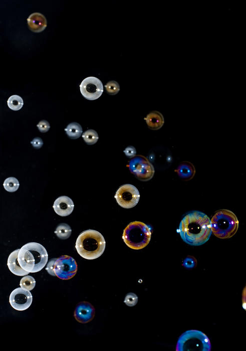 a background image of floating soap bubbles of various colours and sizes
