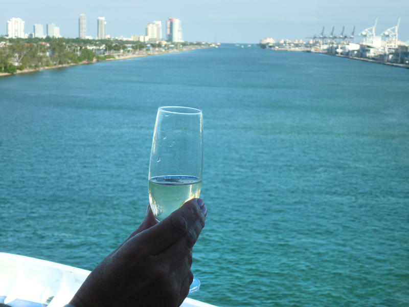 enjoying a glass of champagne on a cruise ship