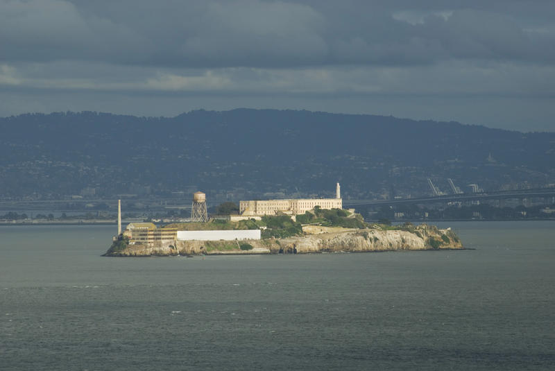 former prison island of alcatraz on a dark stormy day