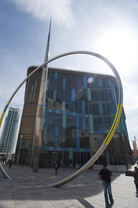 Alliance sculpture, Cardiff, is a stainless steel and enamelled metal arrow column and a hoop, which glows in the dark, and falls and rises with the tide.