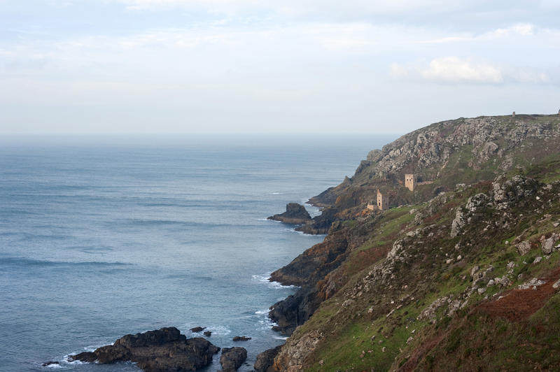 A view along the coastline of the ruins of the engine houses of the tin mines on the Cornish coast which now form part of the Cornwall and West Devon Mining Landscape World Heritage site