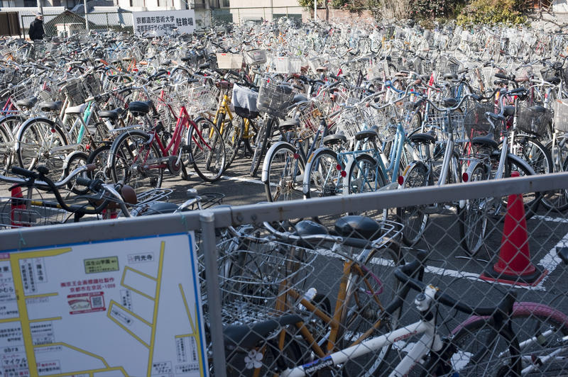 hundereds of cycles in a japanese bicycle parking area