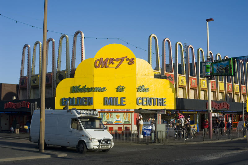View from the street of the brightly coloured yellow entrance to the building housing the Blackpool amusement arcades