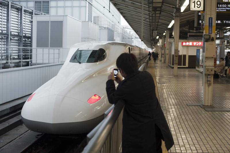 a shinkansen high speed bullet train at a railway station