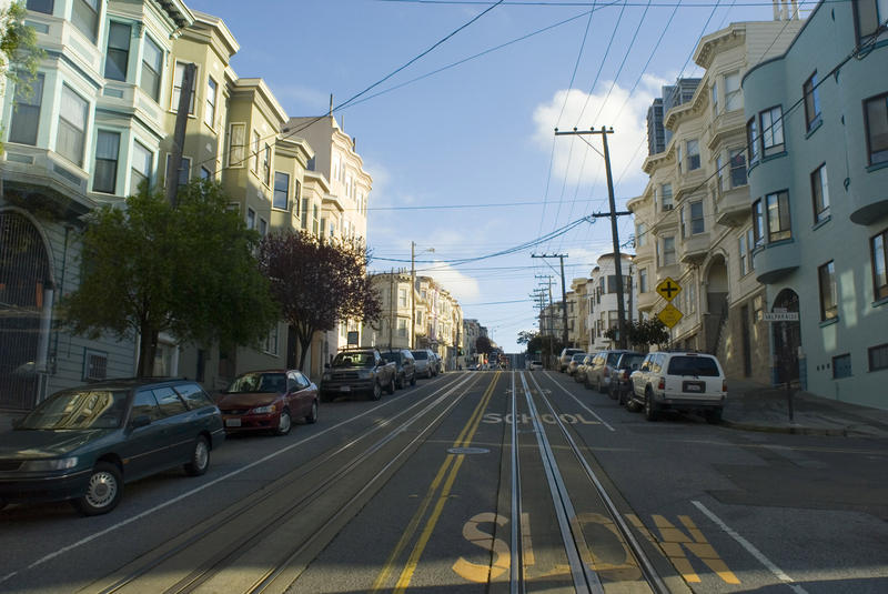 Economic Concept: A slow climb. A ride up a steep hill on a san francisco cable car