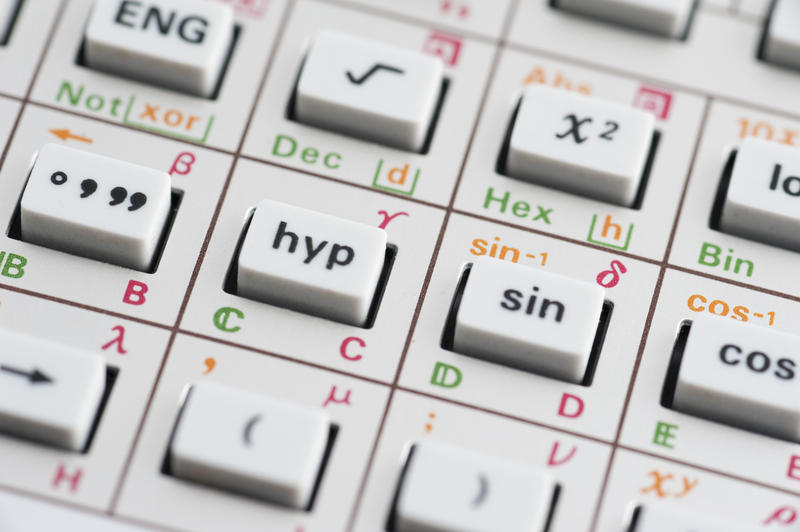 Closeup of a calculator keypad with trigonometric functions for mathematical calculations