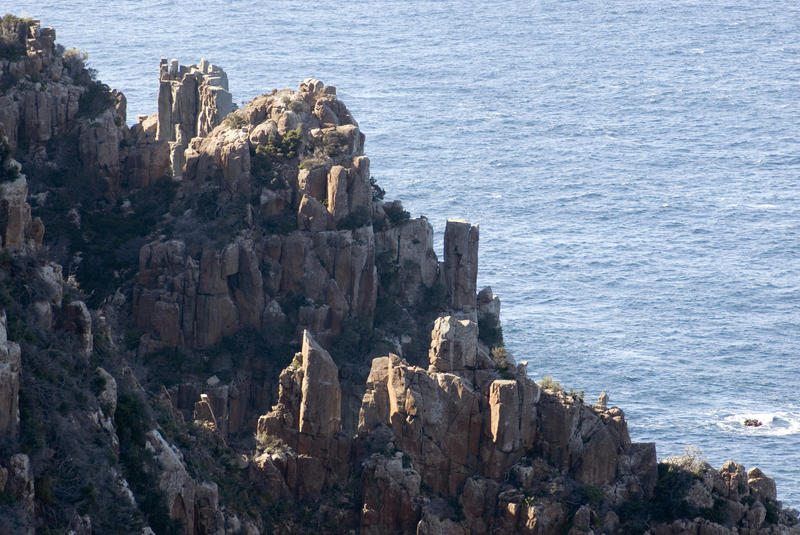 a jagged dolerite rock cliff on the tasman peninsula