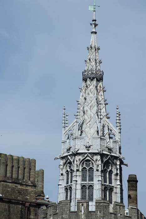 Exterior of the ornate Gothic spire at Cardiff Castle in Wales against a clear blue sky