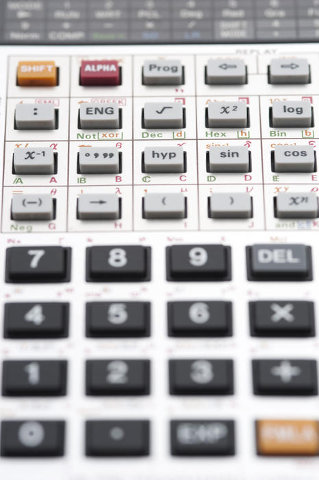 Closeup background of the keypad of a complex scientific calculator with shallow depth of field