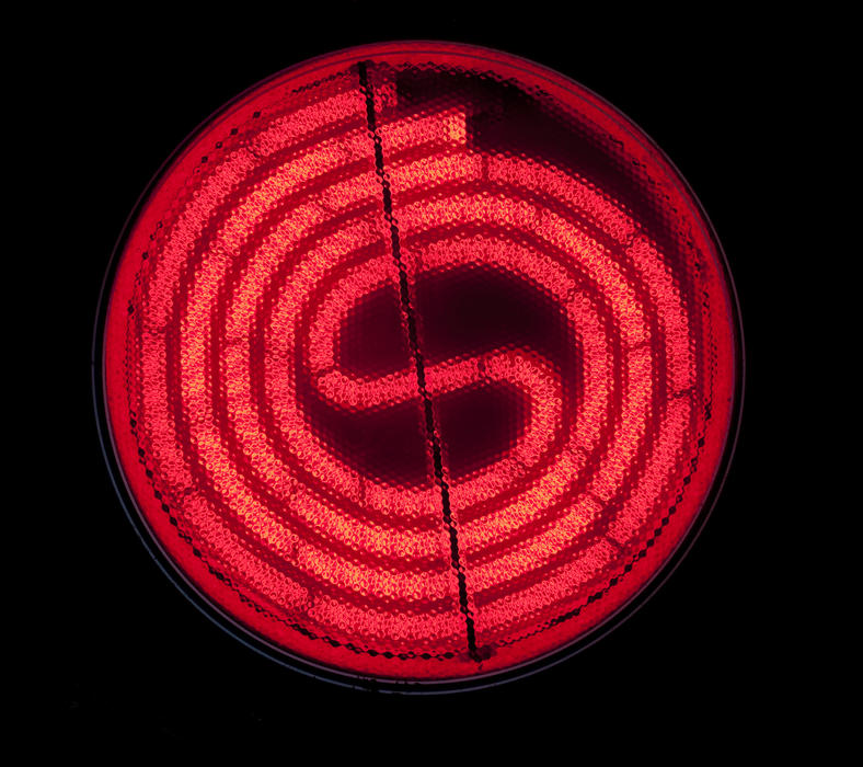 a red hot glowing electric cooker hotplate