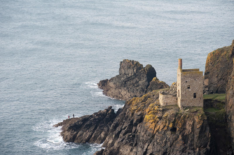 Crown Mines Engine House on the edge of a cliff overlooking the sea where they mined undersea shafts, now part of the West Devon mining landscape world heritage site