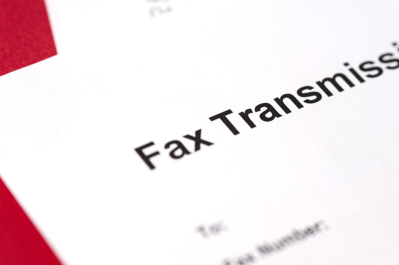 Background of a sheet of white paper with a Fax Transmission header to the document