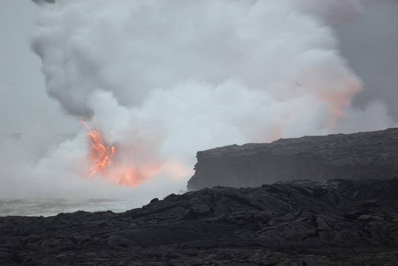 lava errupting into the sea makes a spectacular sight for tourists on hawaiiis big island, Hawaii, USA
