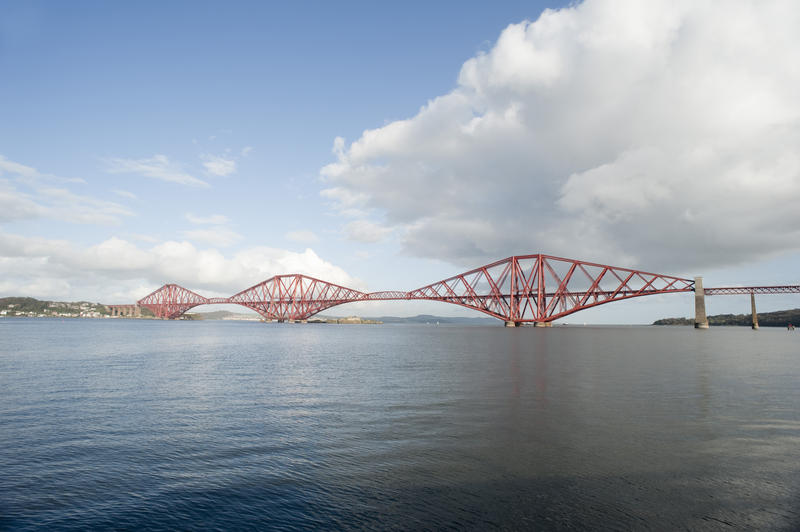 a panoramic image taking in the length of the forth bridge from queensferry looking north