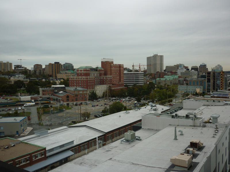 View of Halifax, Nova Scotia, across the rooftops of industrial buildings to the city and skyscrapers on the horizon