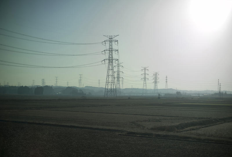 a landscape of metal power transmission towers or pylons