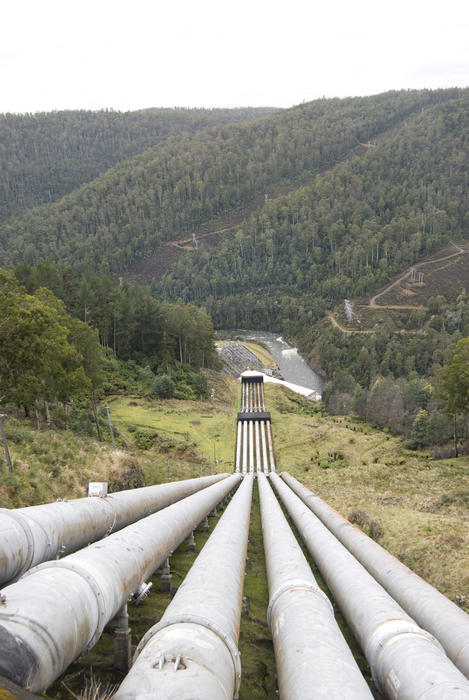 huge water pipes carry water downhill to a hydro electric power station