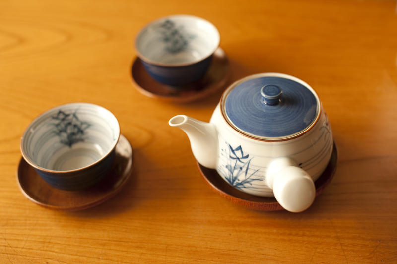 japanese teapot and cups in a wooden table