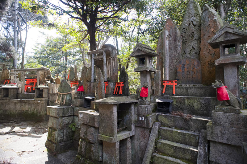 inari temple altars flanked by statues of kitsune the fox god